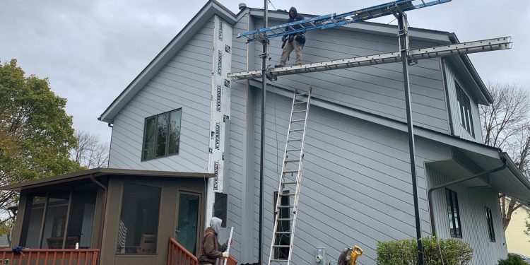 Cedar siding and shingle roofing after hail damage in Bolingbrook project photo 6