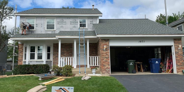Full exterior remodeling vinyl siding installation shingle roof replacement in Naperville project photo 11