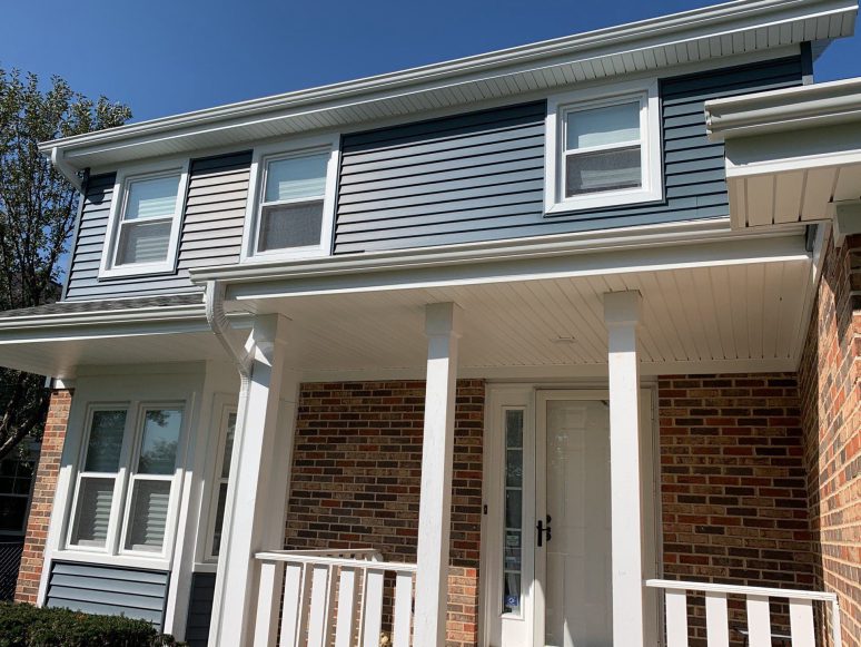 Full exterior remodeling vinyl siding installation shingle roof replacement in Naperville project photo 3