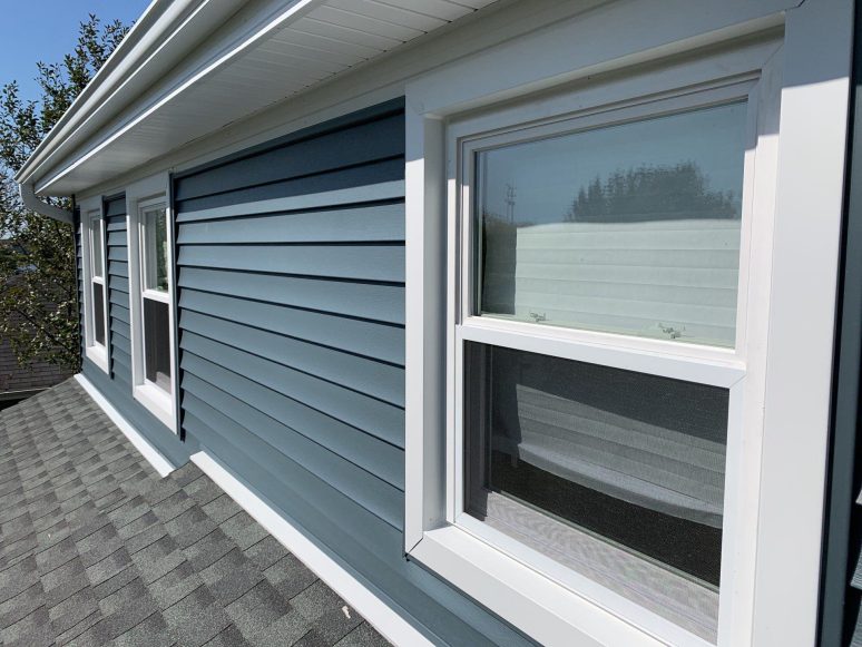 Full exterior remodeling vinyl siding installation shingle roof replacement in Naperville project photo 4