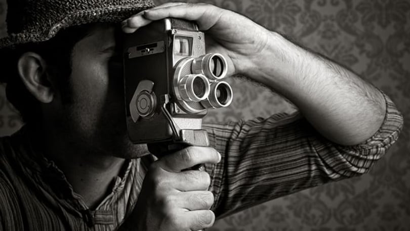 filmaker with vintage camera