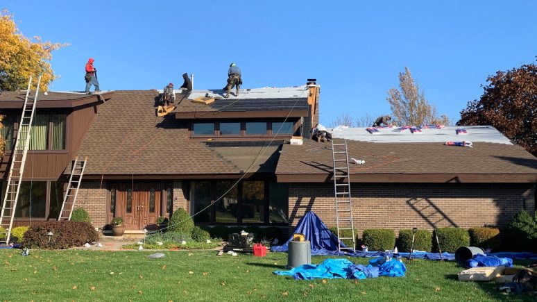 GAF shingle roof installation and guttering in Darien project photo 2