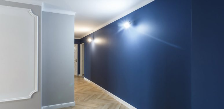 hallway with gray blue walls and white ceiling