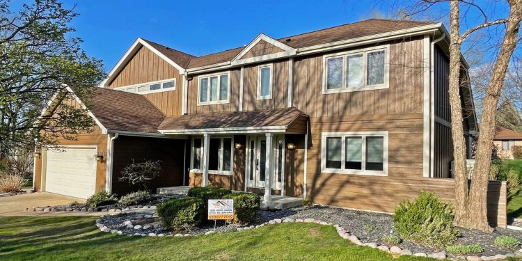 High quality LP SmartSide siding installation and gutters replacement in Downers Grove project photo 1