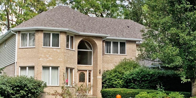 Old roof replacement installing Owens Corning architectural shingles and new gutters in Homer Glen project photo 1