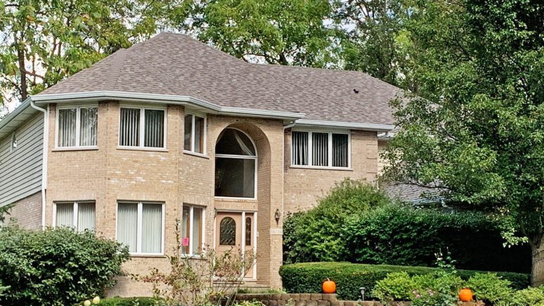 Old roof replacement installing Owens Corning architectural shingles and new gutters in Homer Glen project photo 1