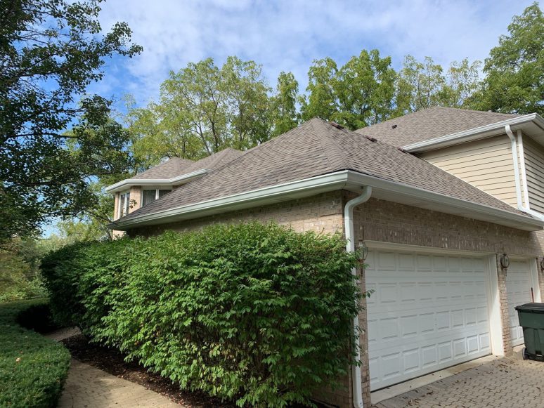 Old roof replacement installing Owens Corning architectural shingles and new gutters in Homer Glen project photo 3