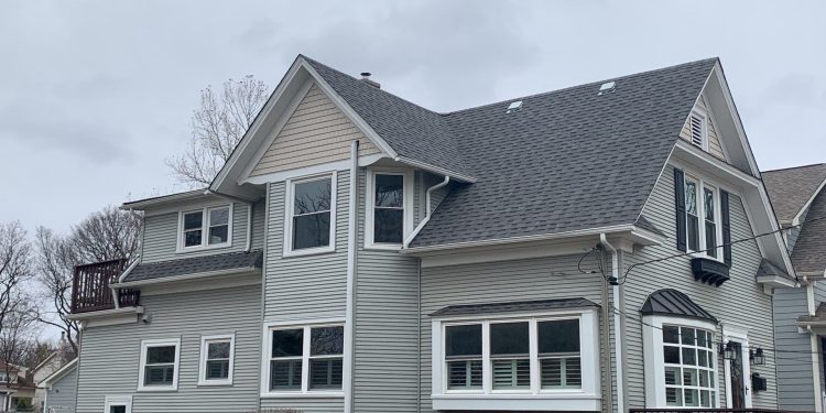 Royal Estate siding installation and shingle roof replacement in Arlington Heights project photo 1