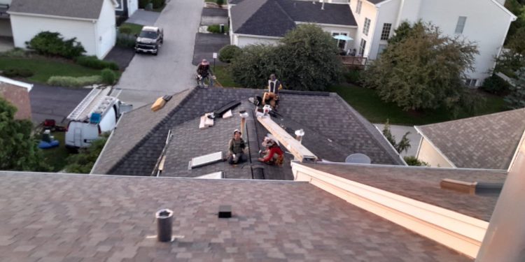 Roof inspection and shingle roofing after hail damage in Geneva project photo 1