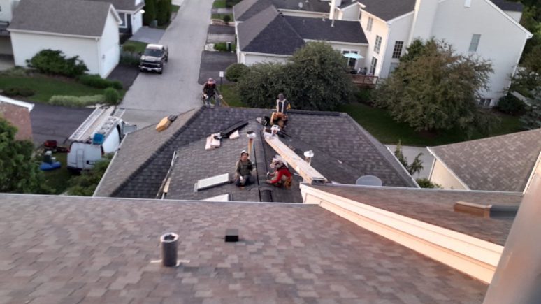 Roof inspection and shingle roofing after hail damage in Geneva project photo 1