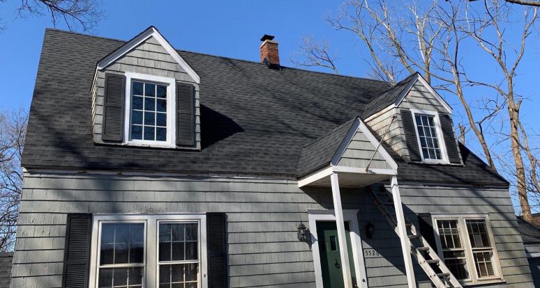 Vinyl siding installation and shingle roof replacement after hail damage in Clarendon Hills project photo 1
