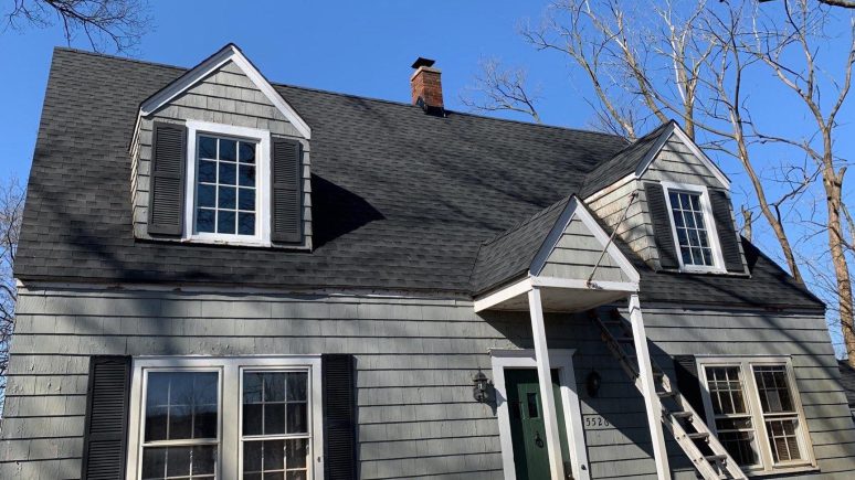 Vinyl siding installation and shingle roof replacement after hail damage in Clarendon Hills project photo 1