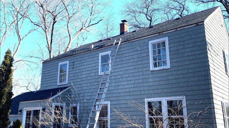 Vinyl siding installation and shingle roof replacement after hail damage in Clarendon Hills project photo 3
