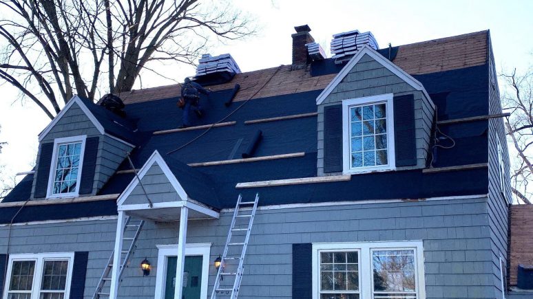 Vinyl siding installation and shingle roof replacement after hail damage in Clarendon Hills project photo 4