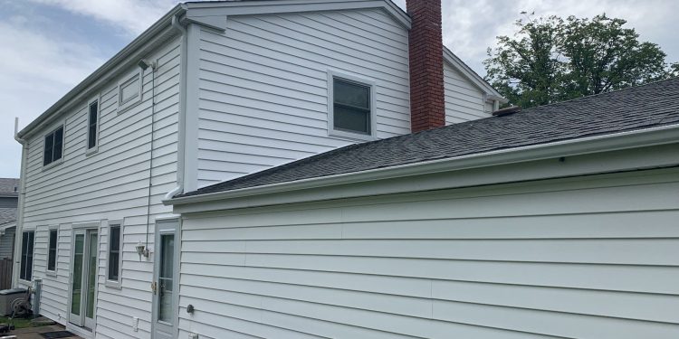 Vinyl siding installation & gutters replacement after hail damage in Downers Grove project photo 1