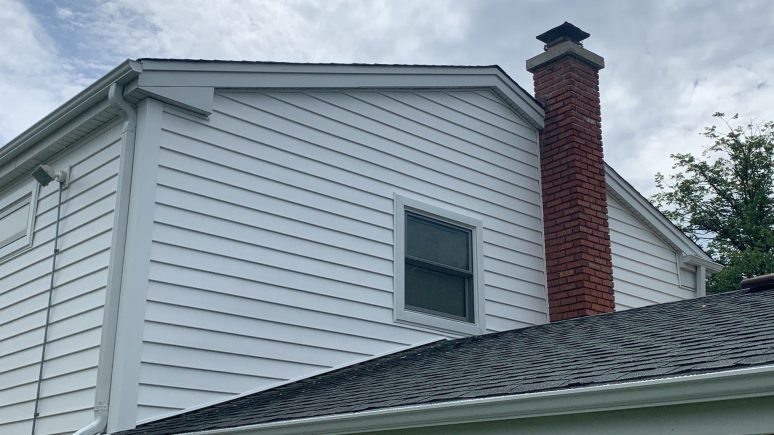 Vinyl siding installation & gutters replacement after hail damage in Downers Grove project photo 2