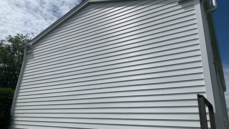 Vinyl siding installation & gutters replacement after hail damage in Downers Grove project photo 3