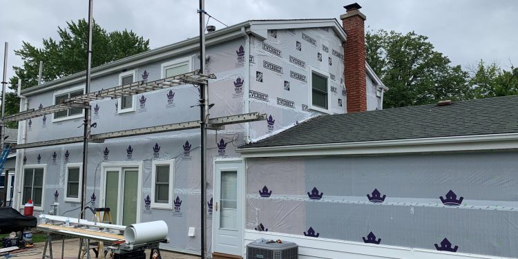 Vinyl siding installation & gutters replacement after hail damage in Downers Grove project photo 8