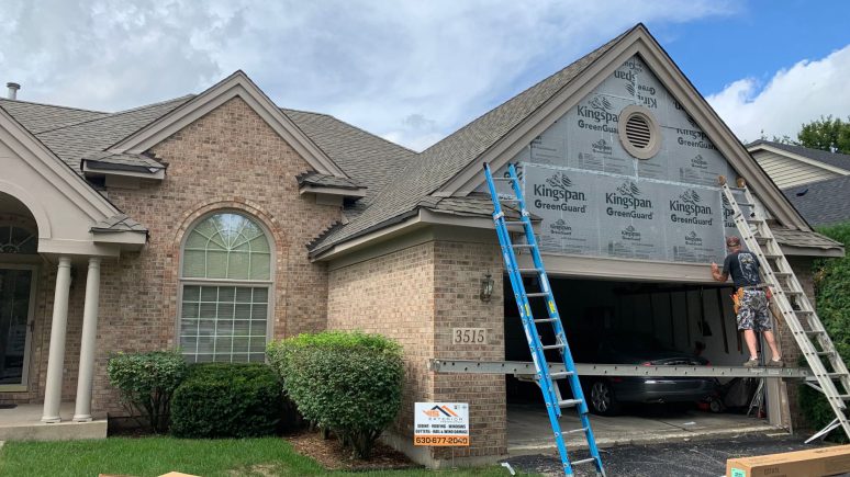 Vinyl siding & shingle roofing after hail damage in Naperville project photo 3