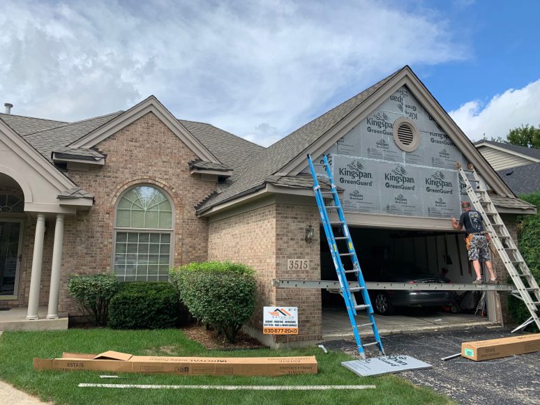 Vinyl siding & shingle roofing after hail damage in Naperville project photo 3