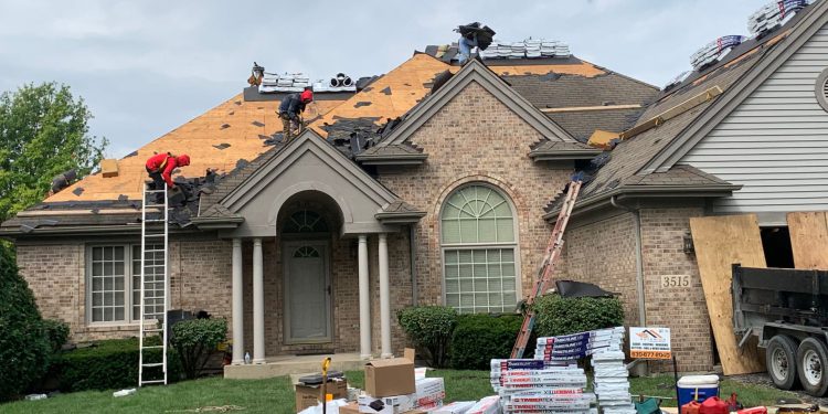 Vinyl siding & shingle roofing after hail damage in Naperville project photo 5