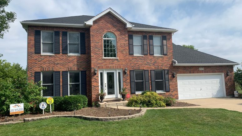 Vinyl siding, roofing & gutters replacement after hail damage in Naperville project photo 1