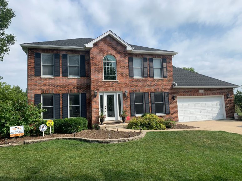 Vinyl siding, roofing & gutters replacement after hail damage in Naperville project photo 1