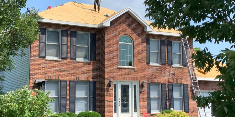 Vinyl siding, roofing & gutters replacement after hail damage in Naperville project photo 3