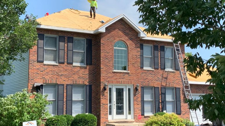 Vinyl siding, roofing & gutters replacement after hail damage in Naperville project photo 3