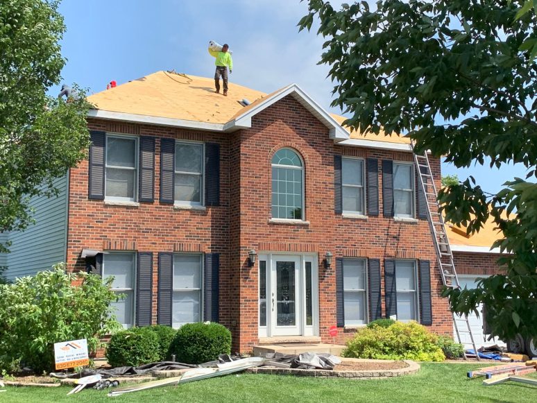 Vinyl siding, roofing & gutters replacement after hail damage in Naperville project photo 3