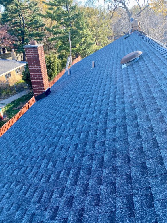 Complete vinyl siding and GAF shingle roof replacement after hail damage in Lombard project photo 2