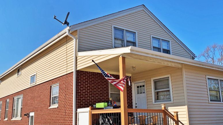 Complete vinyl siding and GAF shingle roof replacement after hail damage in Lombard project photo 3