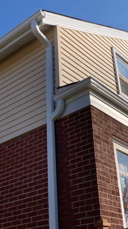 Complete vinyl siding and GAF shingle roof replacement after hail damage in Lombard project photo 4