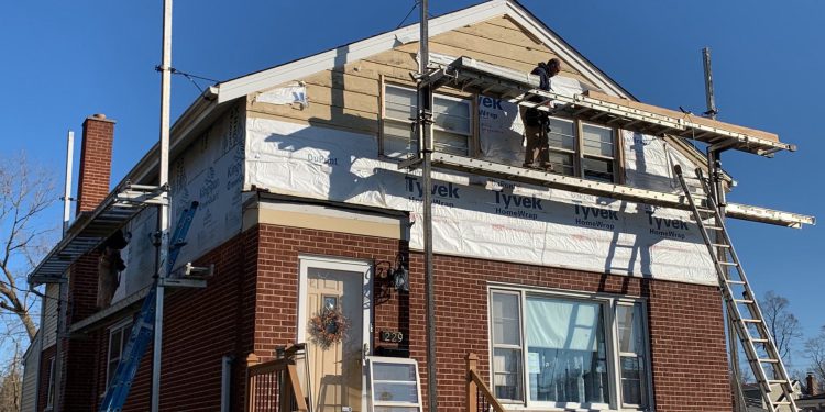 Complete vinyl siding and GAF shingle roof replacement after hail damage in Lombard project photo 5