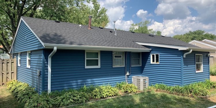 Vinyl siding and shingle roof replacement after hail damage in Woodridge project photo 1