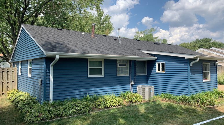 Vinyl siding and shingle roof replacement after hail damage in Woodridge project photo 1