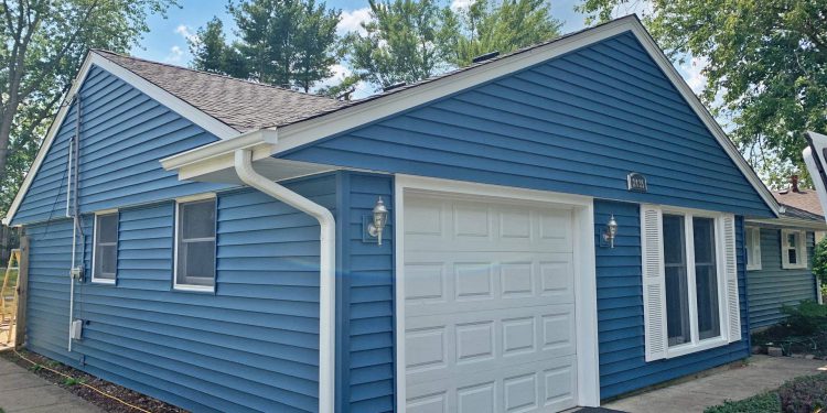 Vinyl siding and shingle roof replacement after hail damage in Woodridge project photo 3