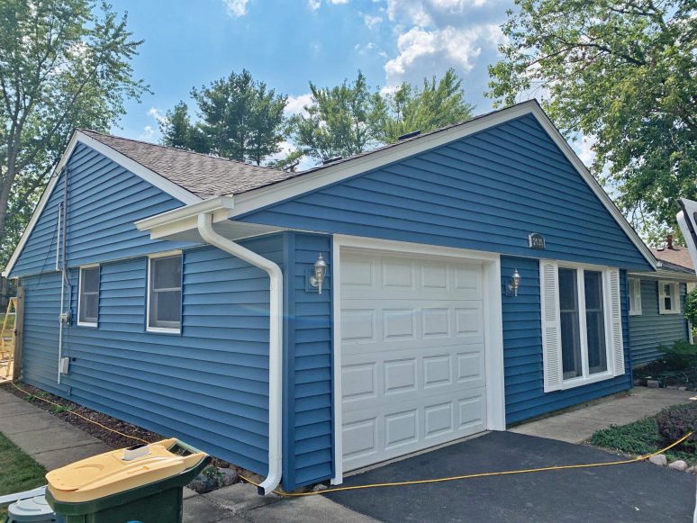 Vinyl siding and shingle roof replacement after hail damage in Woodridge project photo 3