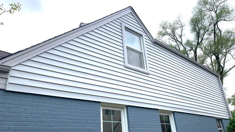 Vinyl siding installation and shingle roof replacement after hail damage in Clarendon Hills project photo 3
